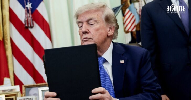 U.S. President Donald Trump signs executive orders at the Oval Office in Washington