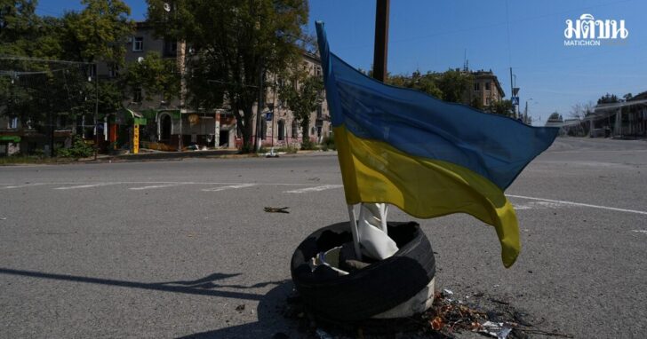 Ukrainian national flag waves on a street in the centre of the frontline town of Druzhkivka