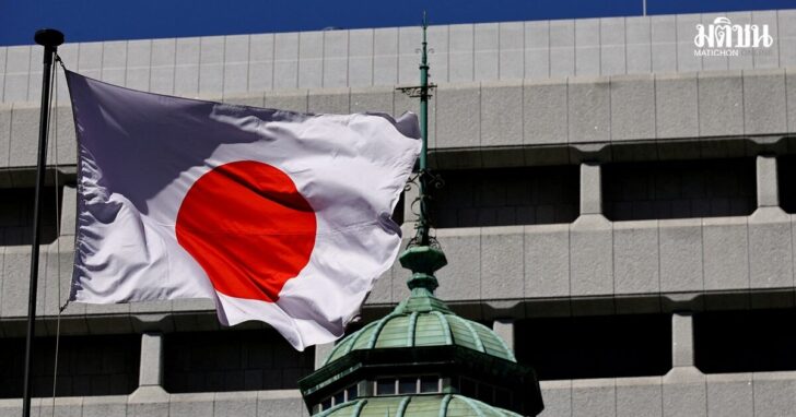 FILE PHOTO: Japanese national flag waves at the Bank of Japan building in Tokyo
